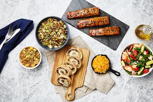 Prepared entrées, side dishes and proteins arranged for evaluation