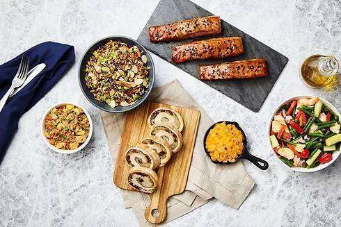 Prepared entrées, side dishes and proteins arranged for evaluation